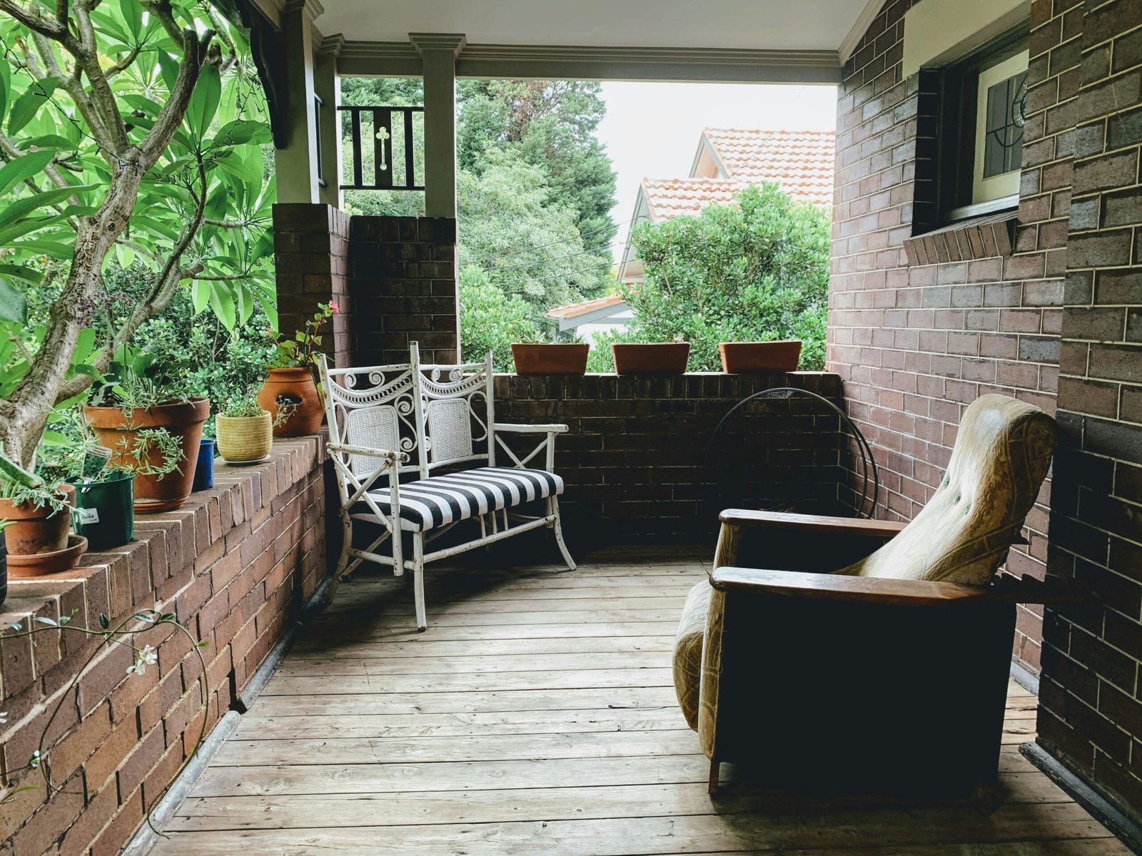 brown and white wicker armchairs